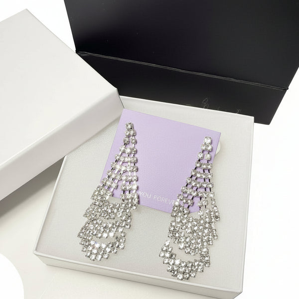 Elegant jewelry gift set presentation with sparkly rhinestone earrings and high-quality gift packaging