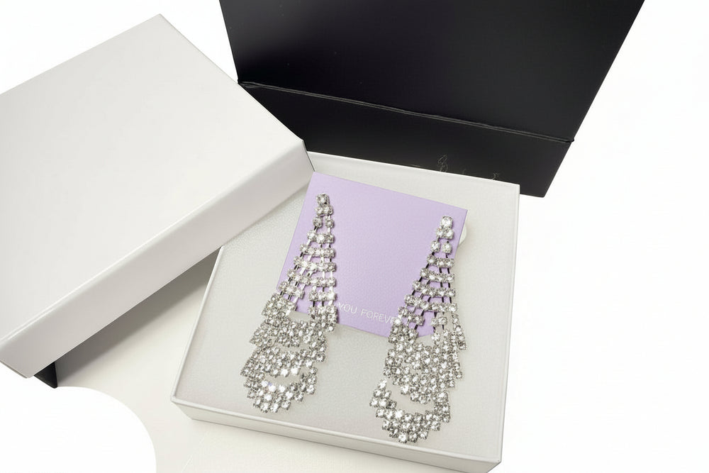 Elegant jewelry gift set presentation with sparkly rhinestone earrings and high-quality gift packaging