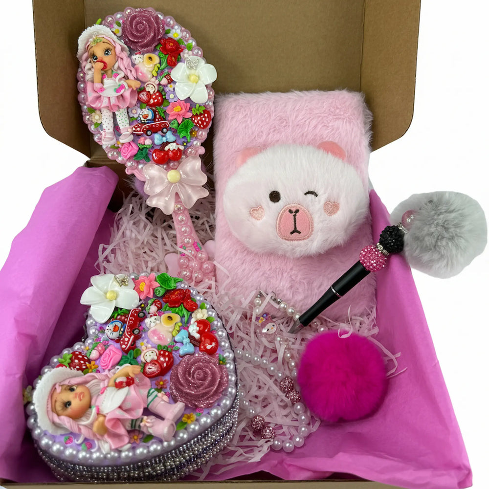 strawberry coquette gift set with a decoden mirror, heart jewelry box, plush journal, keychain, and beaded bracelet.