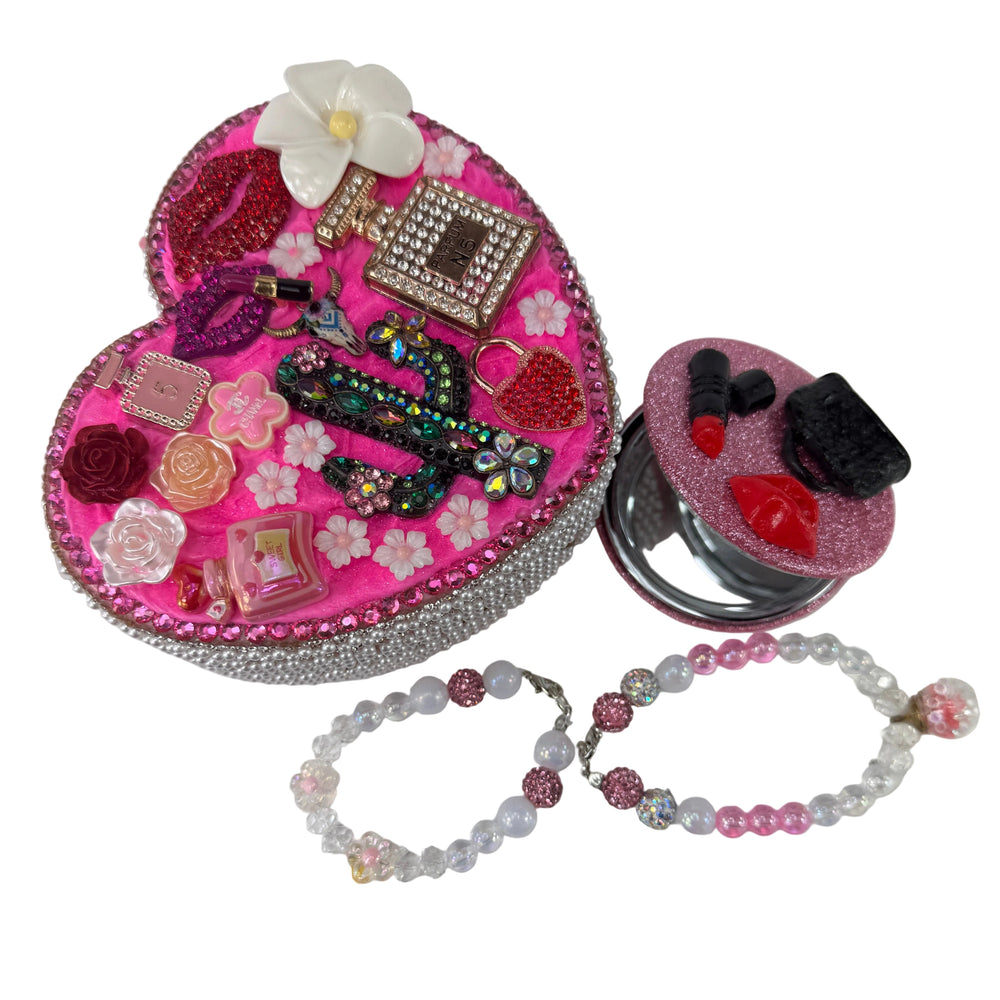 top view of pink heart jewelry box decorated with pink cowgirl hat charms resin flowers and shiny pearls